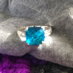 Size 9 silver ring w/blue topaz stone.
